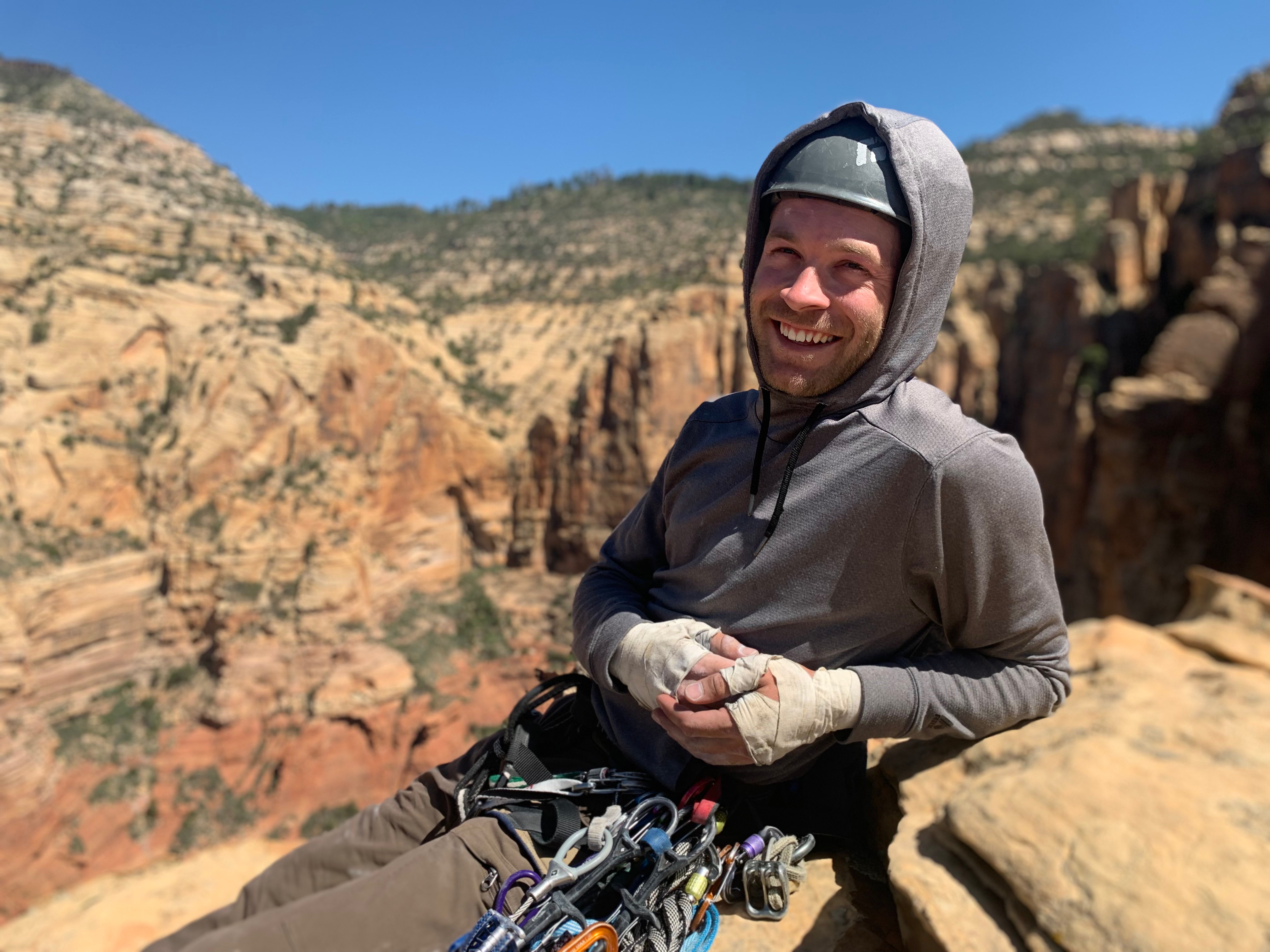 Zachary Wolden, CEO of Sedona Fly Co rock climbing in Sedona Arizona