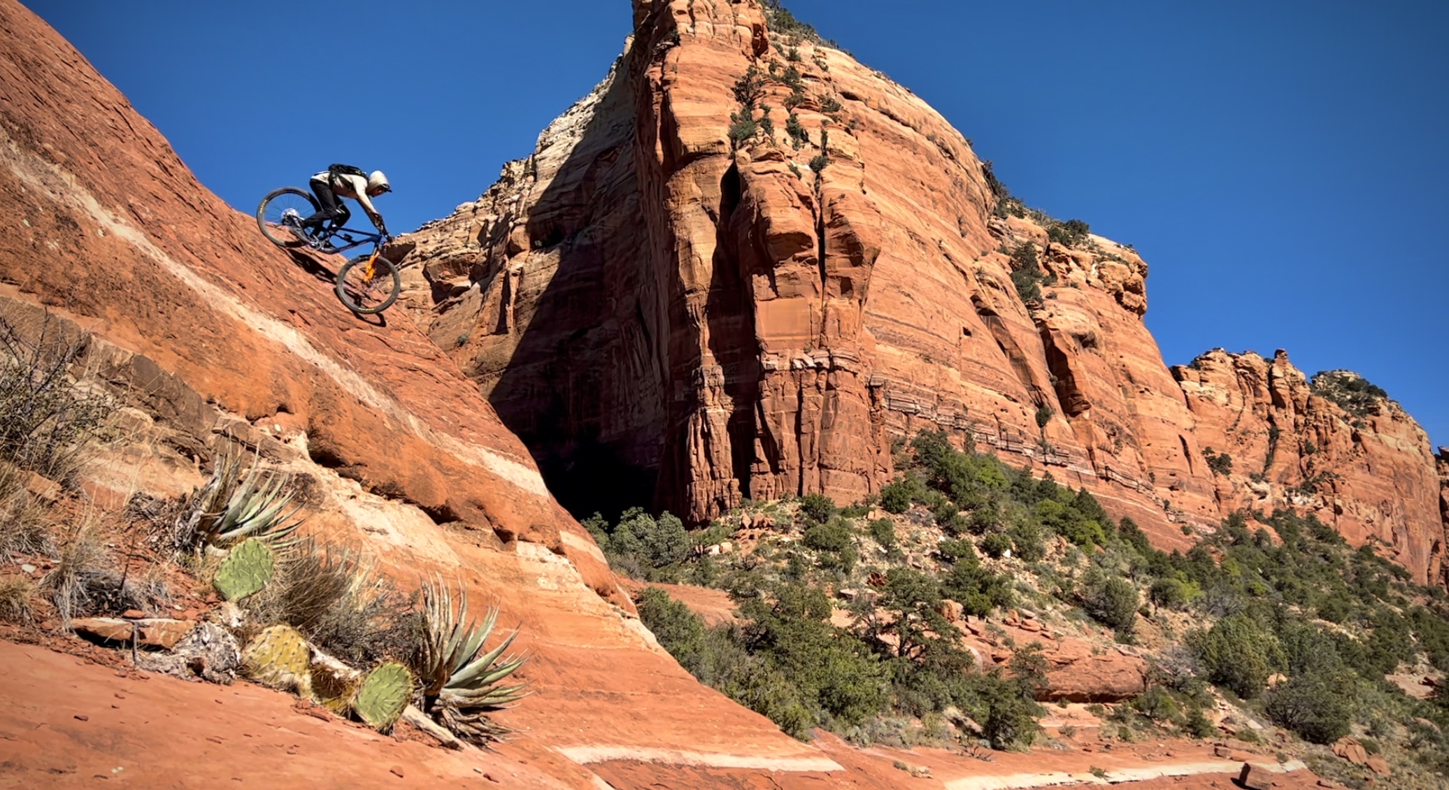 Zachary Wolden, CEO of Sedona Fly co, mountain biking down Hangover Trail in Sedona Arizona